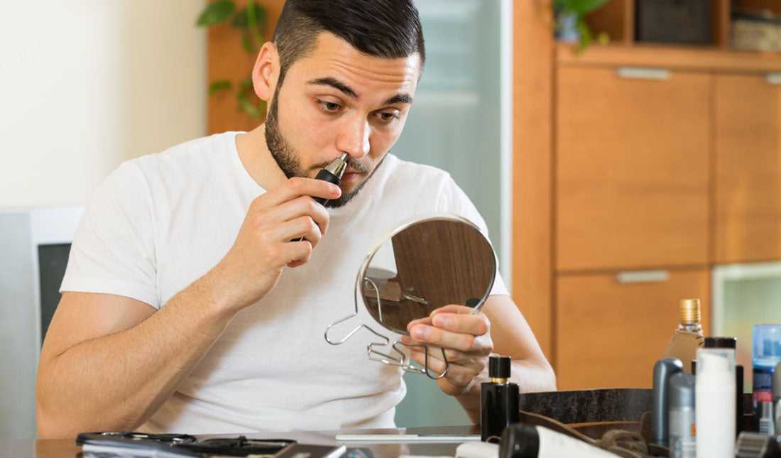 clipping nose hairs with mirror