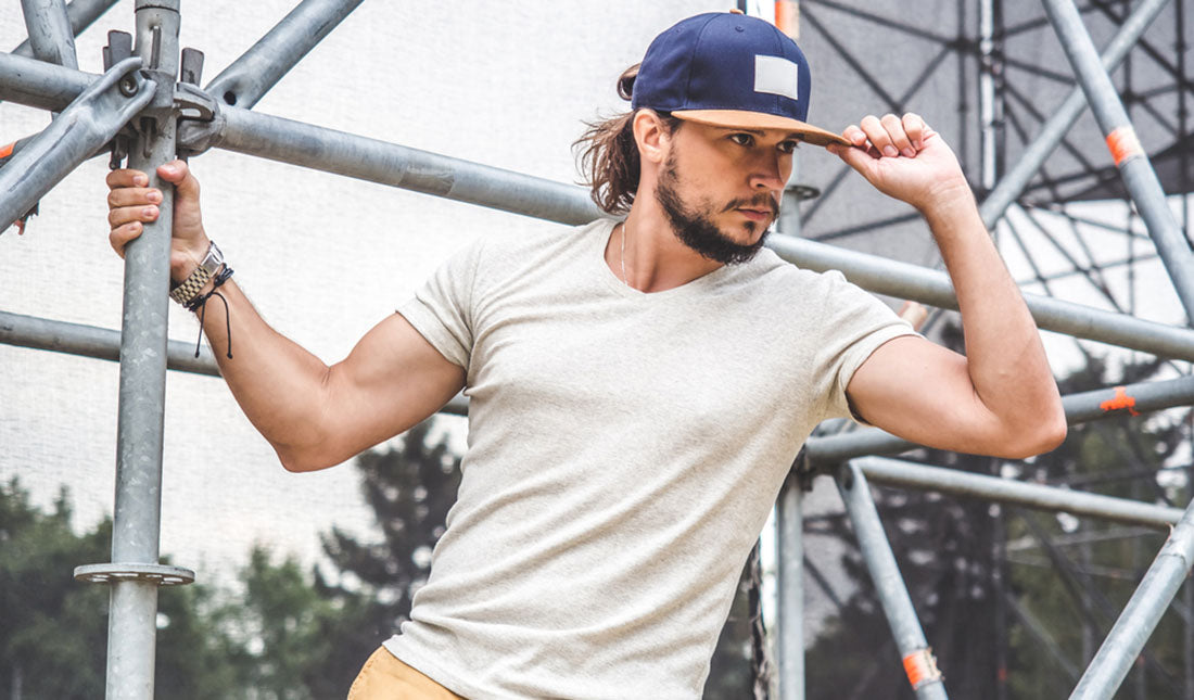 guy posing with baseball cap