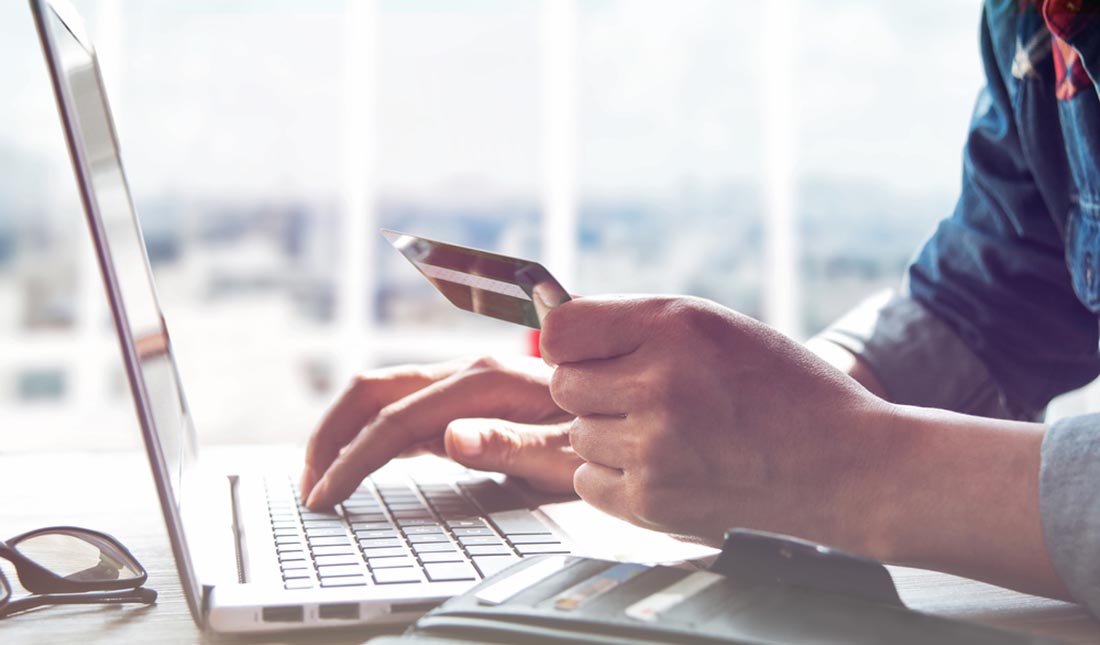 man purchasing online with credit card