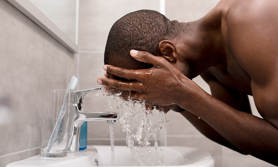 man cleaning face