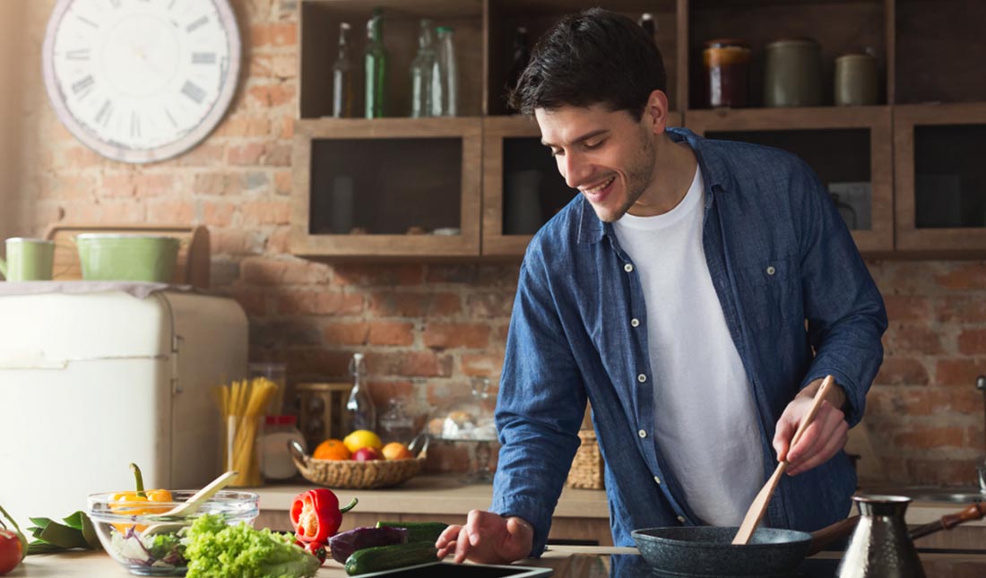 man cooking in kitchen