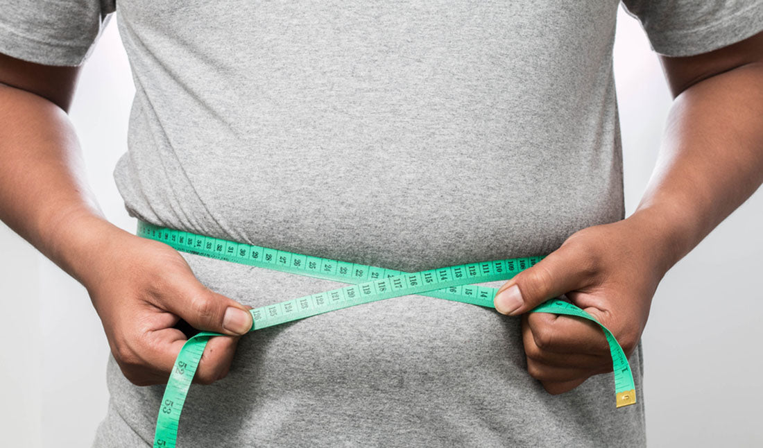 man measuring body fat