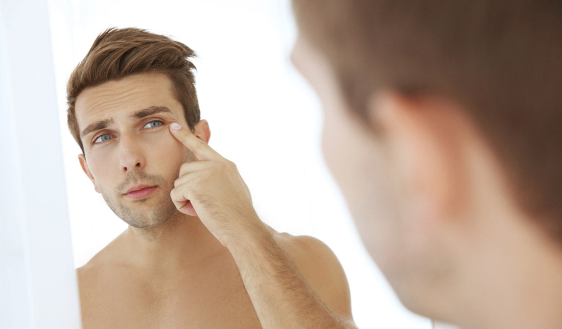 man standing in front of mirror