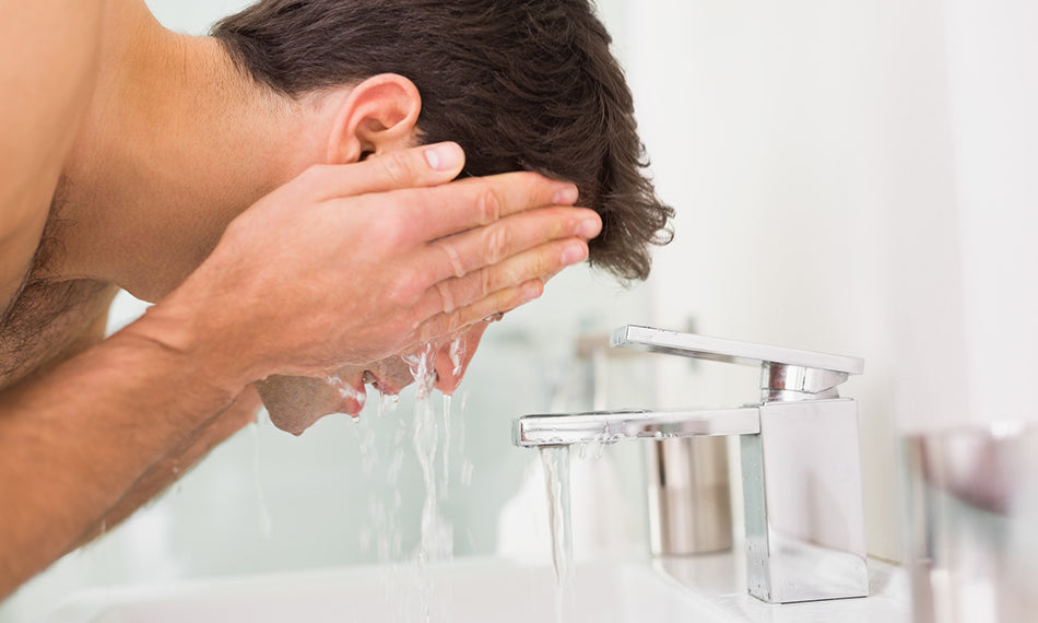 washing face in sink